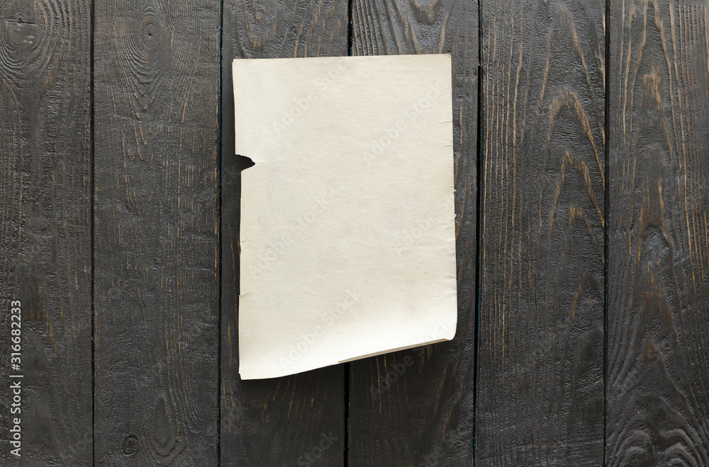 old paper on dark wooden wall old paper on dark wooden wall
