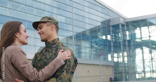 Photography Male soldier smiling and talking with wife.