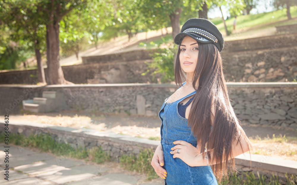 Portrait of young woman in the outdoor.