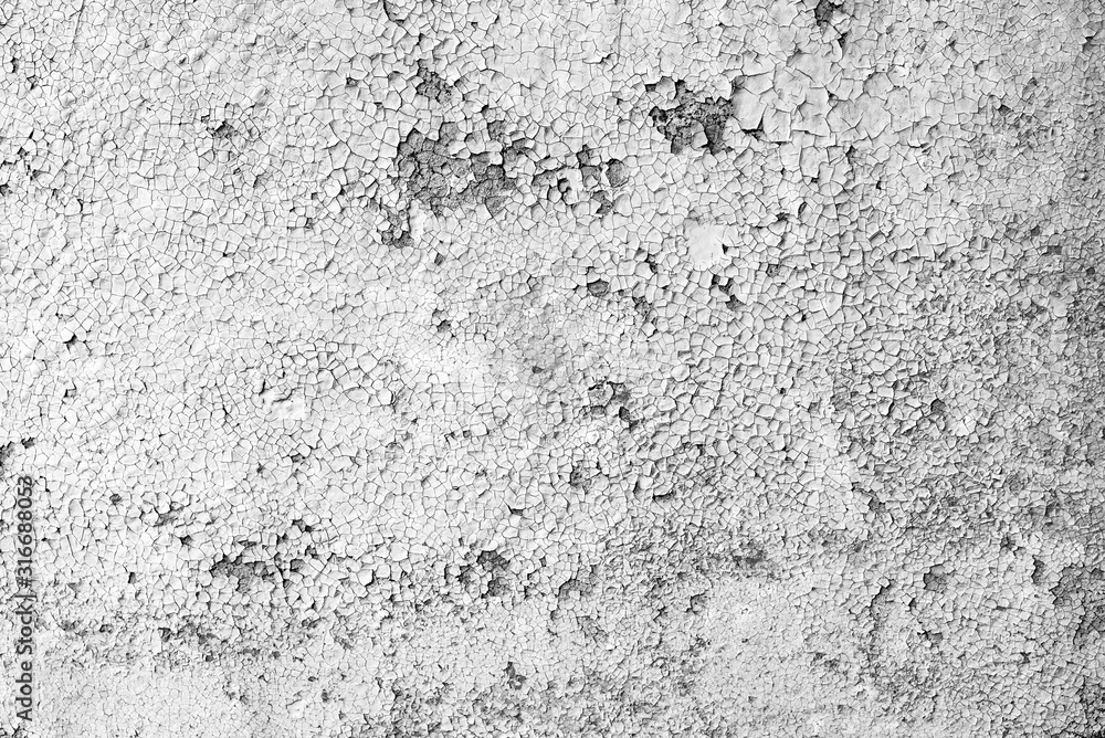 Texture of a metal wall with cracks and scratches which can be used as a background Texture of a metal wall with cracks and scratches which can be used as a background