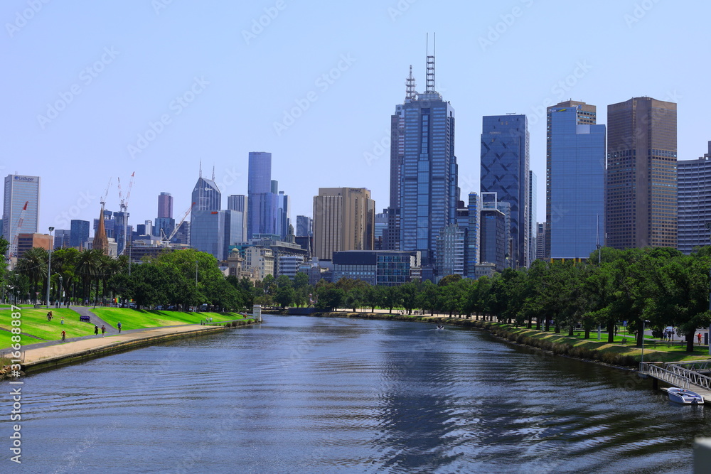 Yarra river with view of buildings and city in Melbourne, Australia