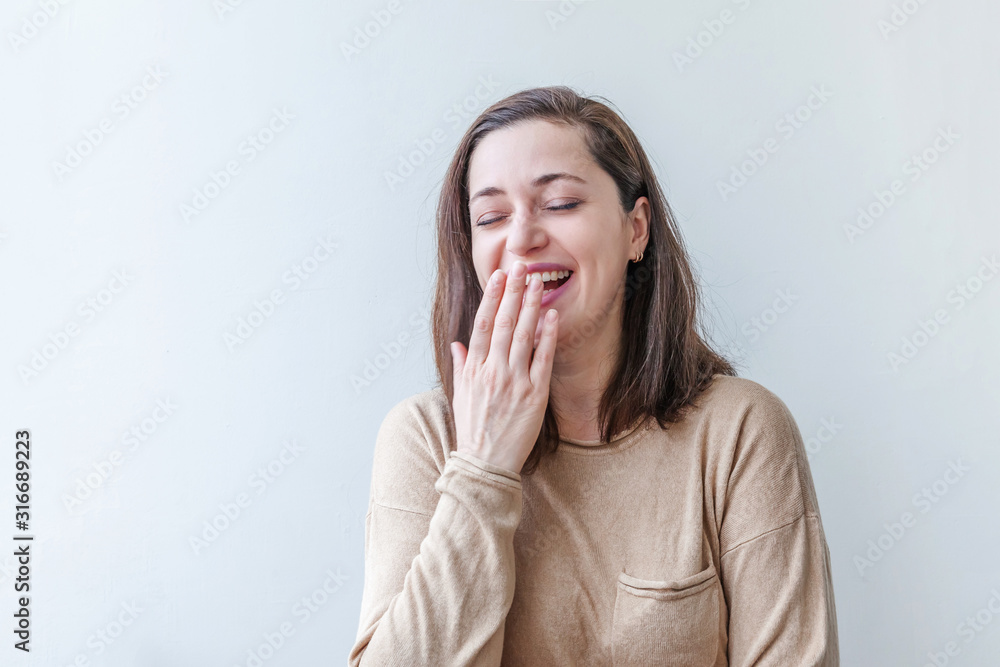 Happy girl smiling. Beauty portrait young happy positive laughing brunette woman on white background isolated. European woman. Positive human emotion facial expression body language Happy girl smiling. Beauty portrait young happy positive laughing brunette woman on white background isolated. European woman. Positive human emotion facial expression body language