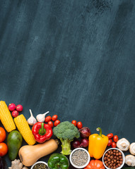 Dieting and healthy eating concept: fruits, vegetables, vegan food ingredients over natural background.