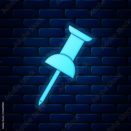 Glowing neon Push pin icon isolated on brick wall background. Thumbtacks sign. Vector Illustration