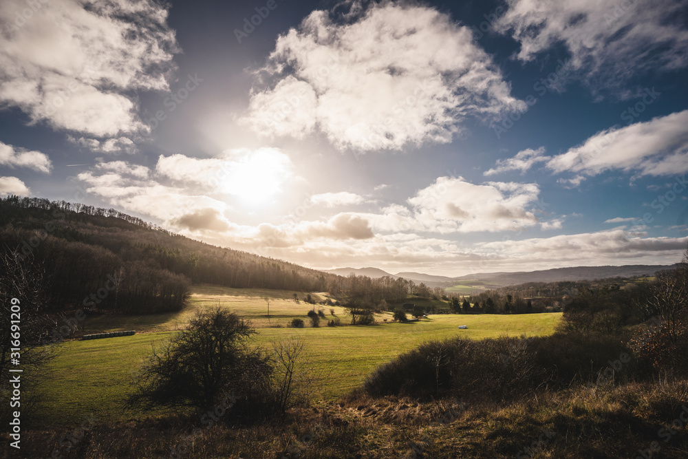 Beuatiful sunset in fields of Czech Republic. Beautiful clouds and shining sun