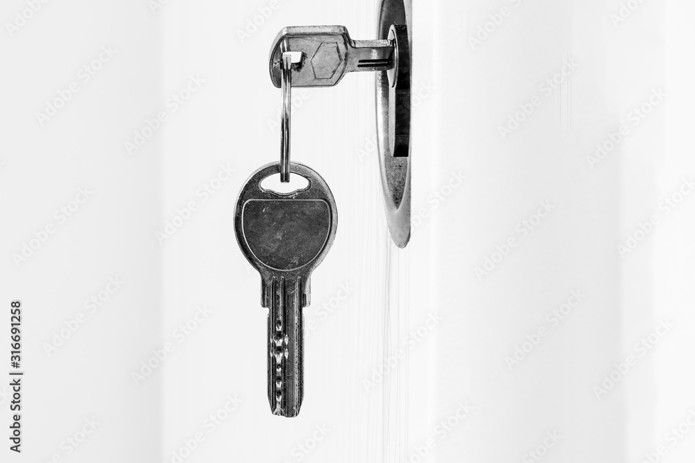 Key in keyhole on door Key in keyhole on door
