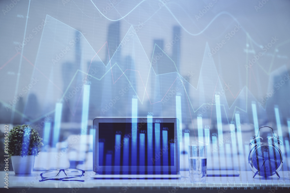 Forex graph hologram on table with computer background. Multi exposure. Concept of financial markets. Forex graph hologram on table with computer background. Multi exposure. Concept of financial markets.