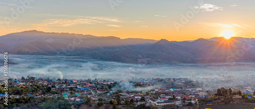 View of village covered in foggy during morning sunrise.Panoramic