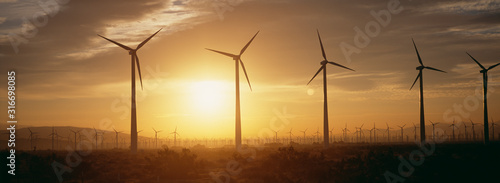 Obraz na plátne Wind farm turbines at dawn