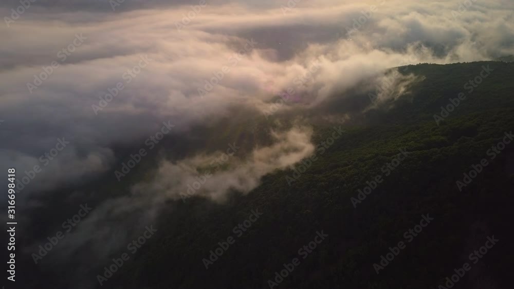 Drone shot of fog over city in the morning Drone shot of fog over city in the morning