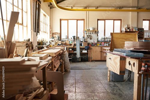 Interior of a large bright woodworking workshop photo