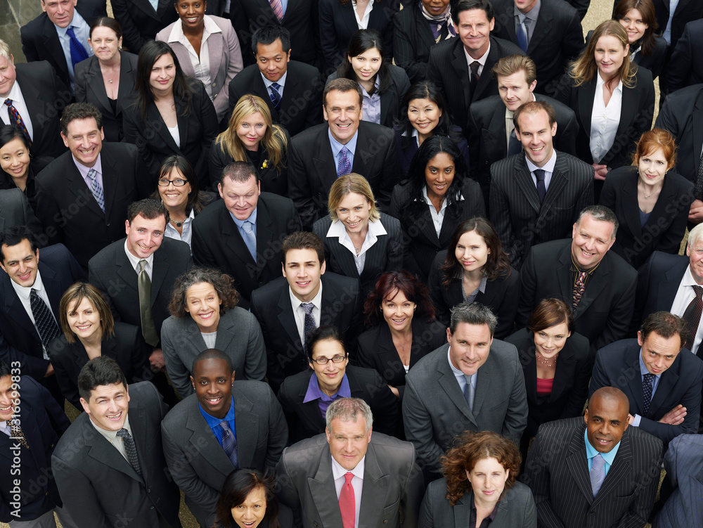 Overhead photo of large gathering of people in a large business crowd