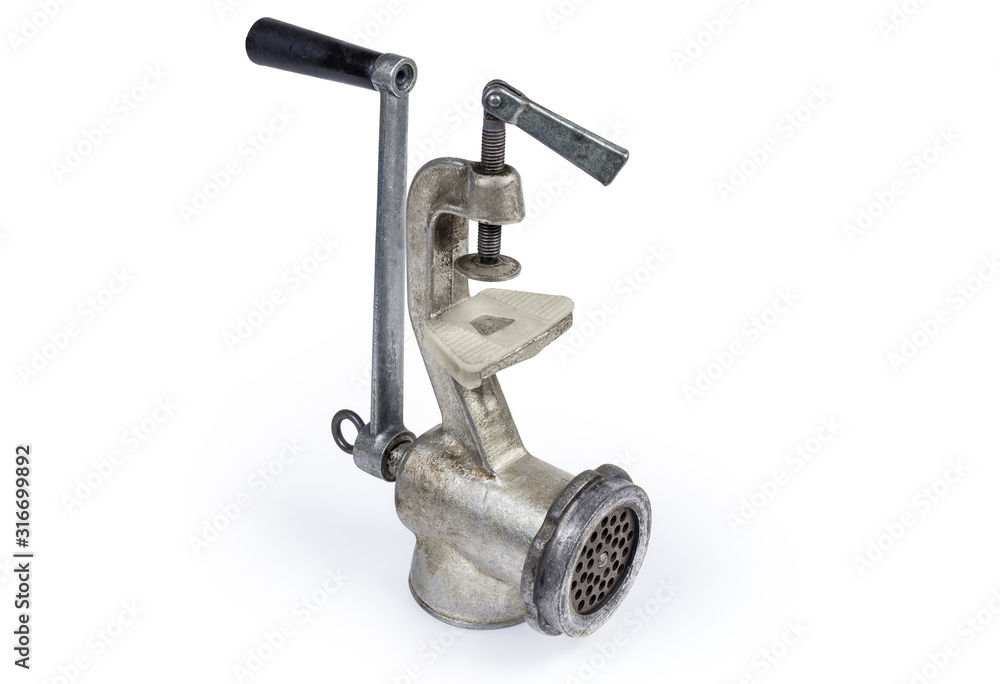 Inverted old hand meat grinder on a white background Inverted old hand meat grinder on a white background