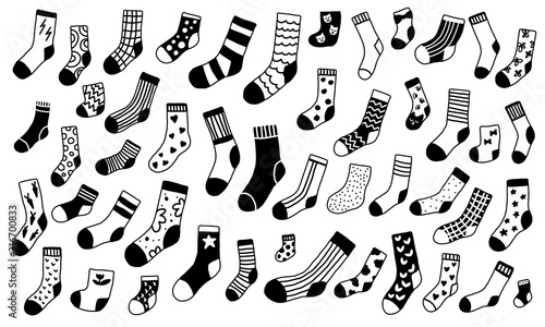 Hand drawn sock collection. Doodle black and white socks with different texture. Winter trendy clothing items