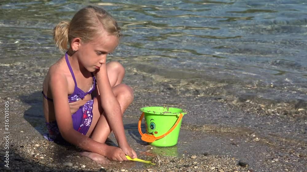 4K Kid Playing in Sand on Beach, Child Plays in Waves on Seashore, Girl Building Castle Bay on Coastline 4K Kid Playing in Sand on Beach, Child Plays in Waves on Seashore, Girl Building Castle Bay on Coastline