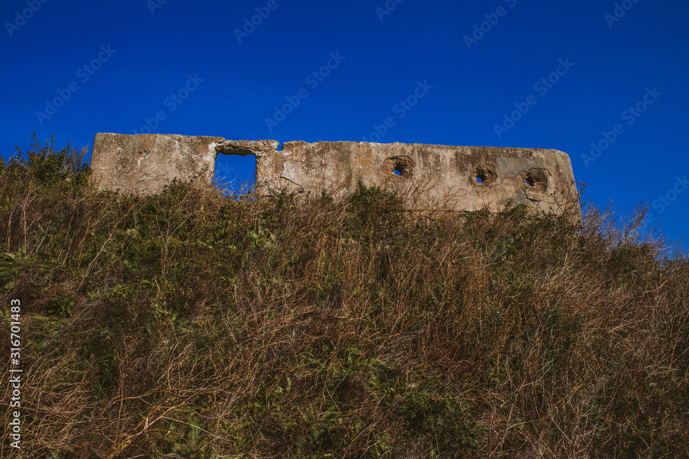 The clear blue sky in Sunny weather, the green grass on the mountain, the old ruins of the historical fortress are comparable in grandeur only to the destroyed city-the citadel was abandoned