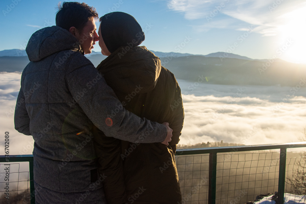 Holidays in the mountains. Young attractive gay couple.