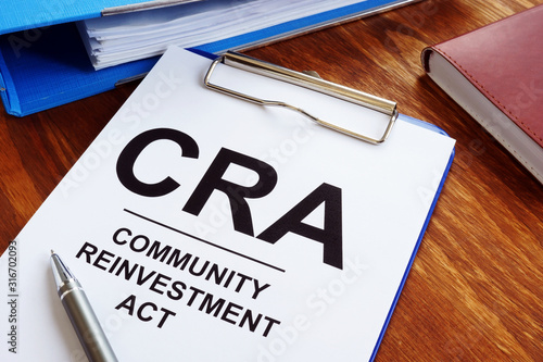 Community Reinvestment Act CRA in the blue clipboard. photo