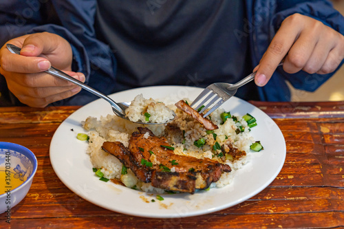 Wallpaper Mural Woman eating Vietnamese pork chop rice- Com Tam Torontodigital.ca