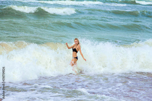girl in surf © tugolukof