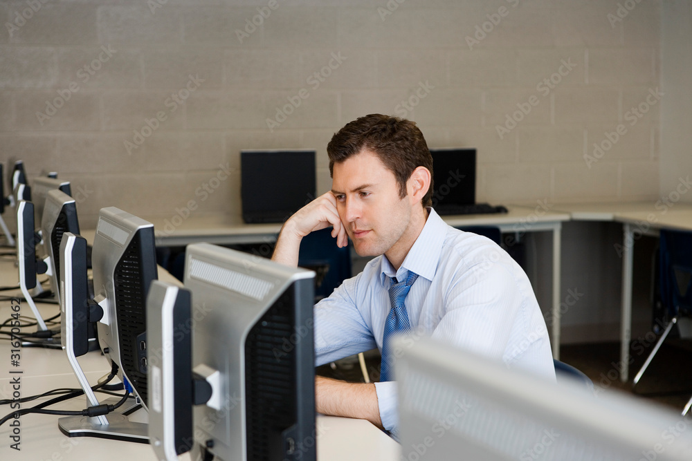 Fototapeta premium High School Teacher in Computer Lab