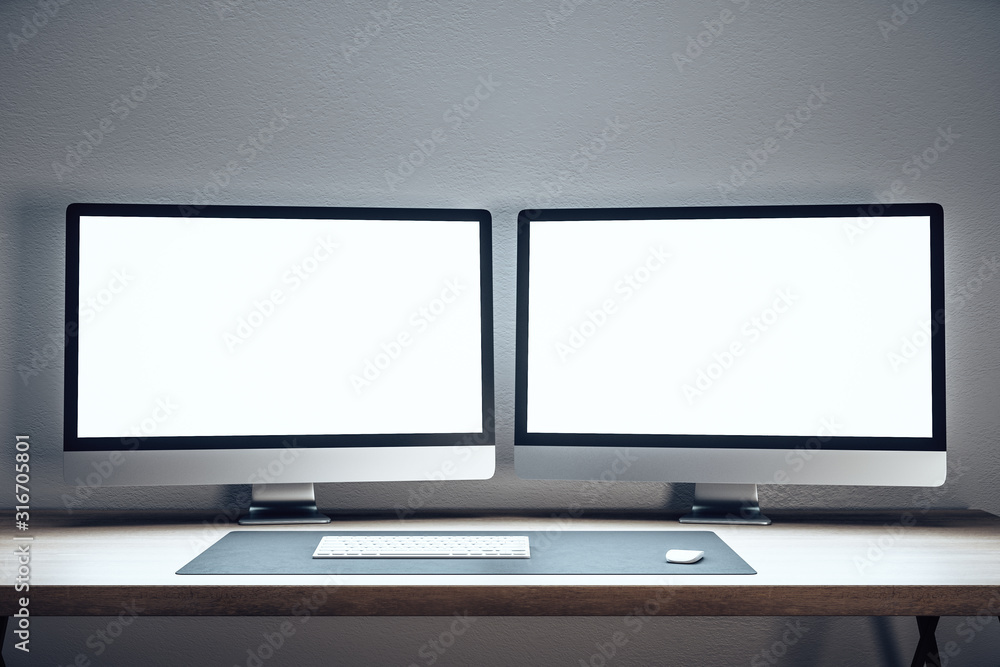 Designer desktop with two empty computer monitor Designer desktop with two empty computer monitor