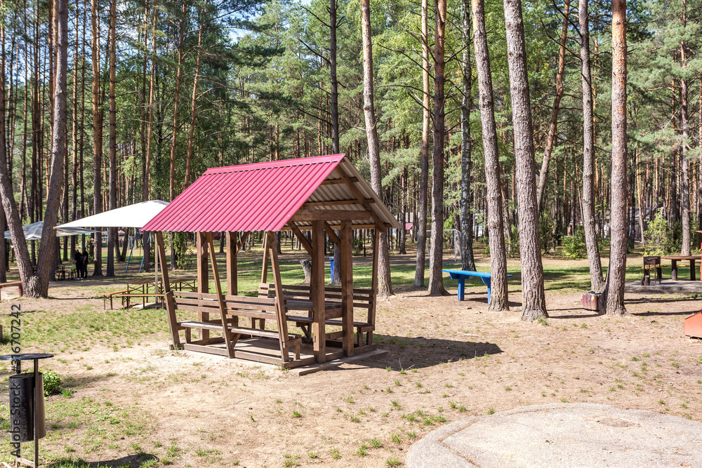 wooden camping arbors  with all conviniences in a pine forest