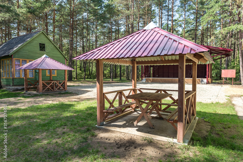 wooden camping arbors with all conviniences in a pine forest wooden camping arbors with all conviniences in a pine forest