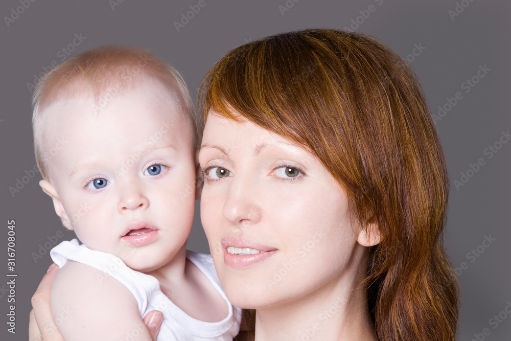 Portrait of mid adult woman with her cute little daughter Portrait of mid adult woman with her cute little daughter