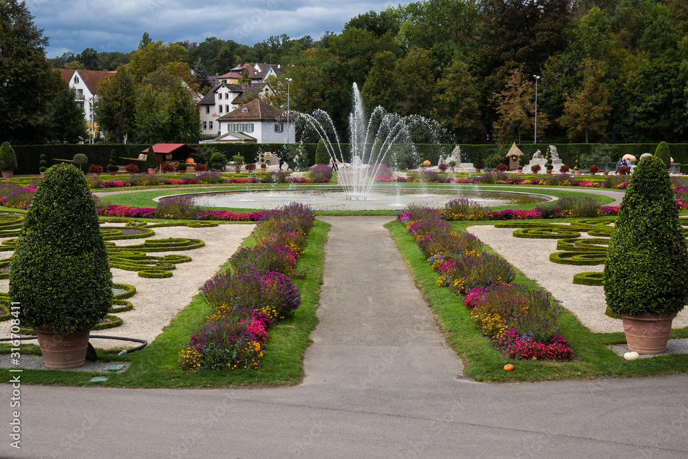 fountain in park of baroque castle