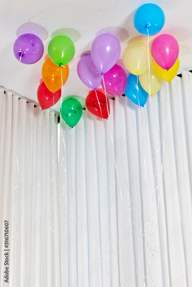Group of multicolored helium party balloons