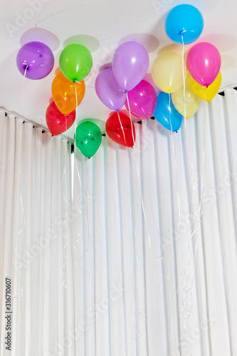 Group of multicolored helium party balloons