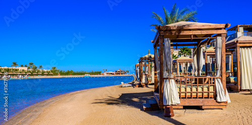 Fototapeta Naklejka Na Ścianę i Meble -  Relaxing at beach at white beach - travel destination for vacation - Hurghada, Red Sea, Egypt