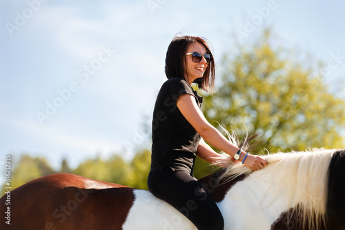 Canvas Print Girl rides a horse bareback