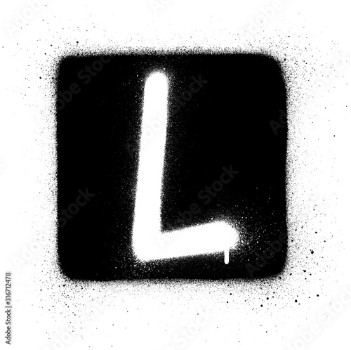 graffiti L font sprayed in white over black square