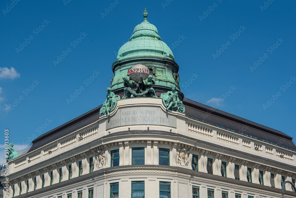 Vienna, Austia - June 4, 2019; Generali insurance building with logo and statue in the center of Vienna on a blue sky Vienna, Austia - June 4, 2019; Generali insurance building with logo and statue in the center of Vienna on a blue sky