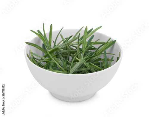 fresh rosemary in the white bowl isolated on white background