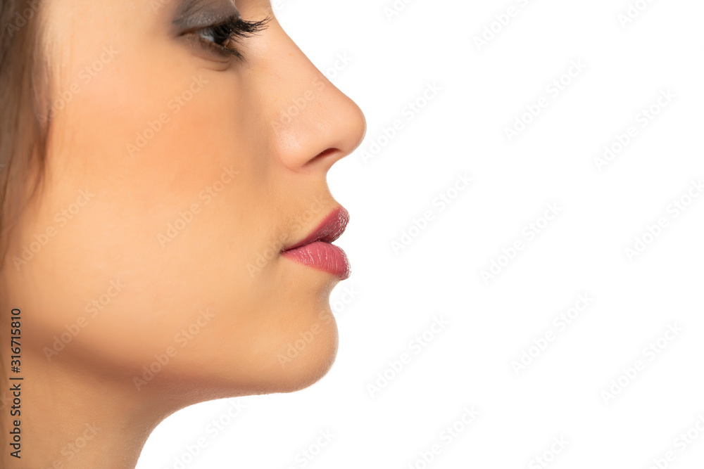closeup profile of young beautiful woman closeup profile of young beautiful woman