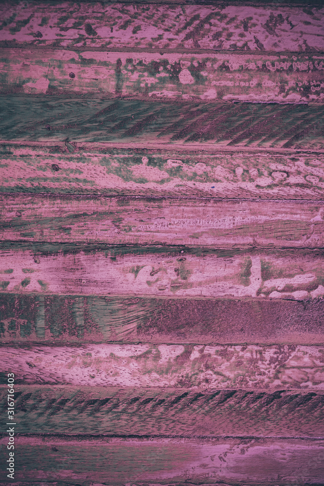 Close up view of magenta wood texture and background. Rustic vintage wood.   