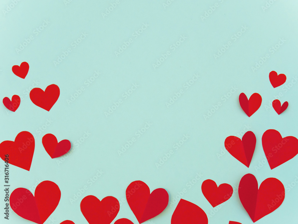 Valentine's day greeting card with red heart on cyan background with copyspace for text.