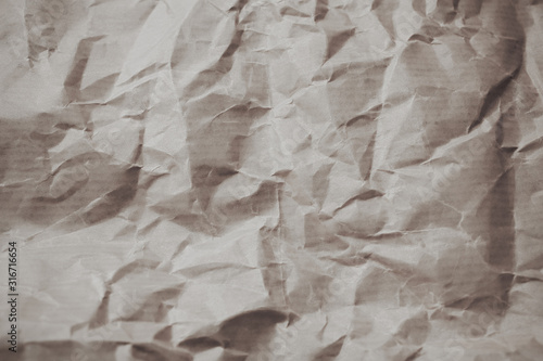 White rough crumpled paper as texture and background for design. 