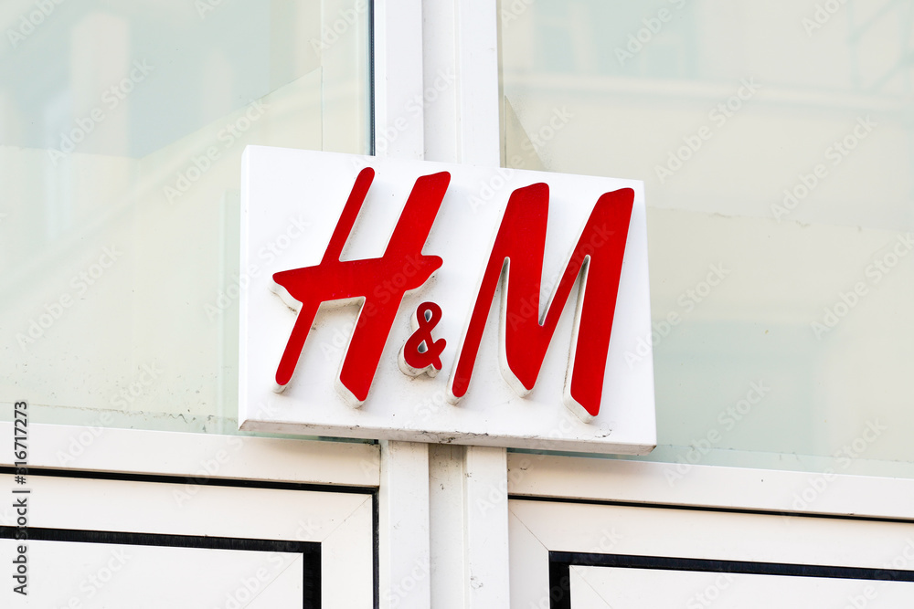 H&M logo sign store H & M Hennes Mauritz AB Swedish multinational retail  clothing company fashion clothing shop Stock Photo | Adobe Stock