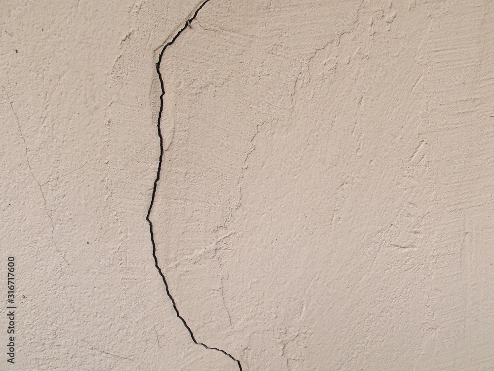 Obraz premium Pink wall with a crack.