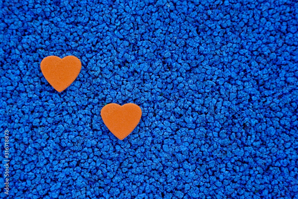 red hearts shape decoration on the blue background for valentine's day red hearts shape decoration on the blue background for valentine's day