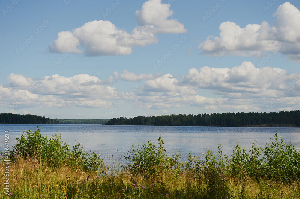 Foggy landscape of northern nature. Magnetic sunny view of the islands and fjords. Awesome sunrise on the lake. Ladoga lake. Smoky summer landscape. Primeval Russia. Archipelago. Republic Karelia.
