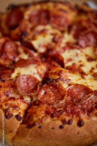 Pepperoni pizza closeup with selective focus