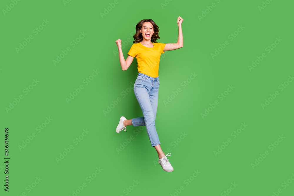 Full length body size view of her she nice attractive lovely cheerful cheery lucky wavy-haired girl jumping celebrating having fun isolated over bright vivid shine vibrant green color background Full length body size view of her she nice attractive lovely cheerful cheery lucky wavy-haired girl jumping celebrating having fun isolated over bright vivid shine vibrant green color background