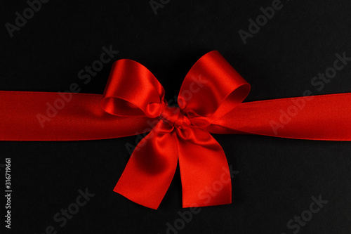 Red bow on black