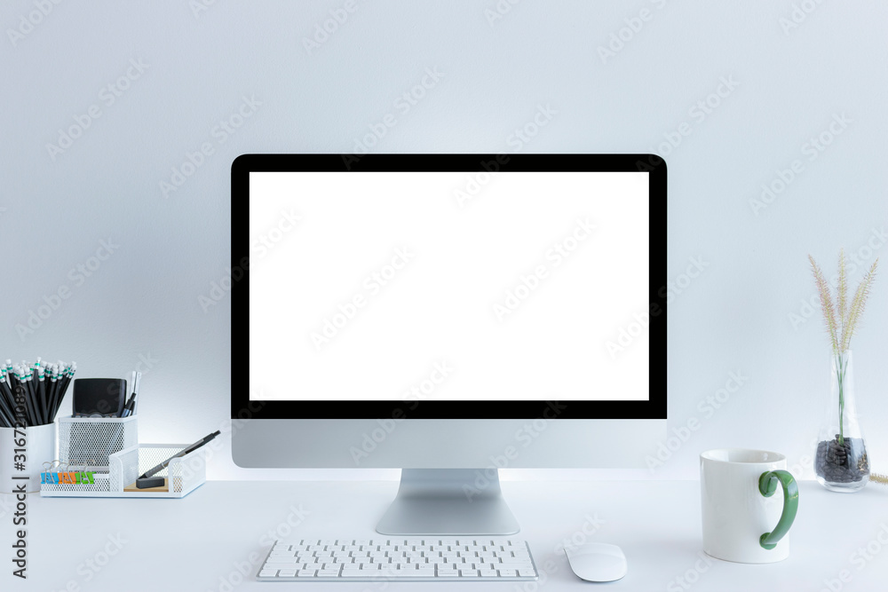 Computer with blank white copy space for text, Mockup design desktop computer in office on white table with keyboard and Coffee cub, Work place concept. Computer with blank white copy space for text, Mockup design desktop computer in office on white table with keyboard and Coffee cub, Work place concept.