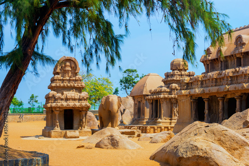 ancient Hindu monolithic Indian sculptures rock cut architecture Pancha Rathas  Five Rathas, Mahabalipuram, Tamil Nadu, South India photo
